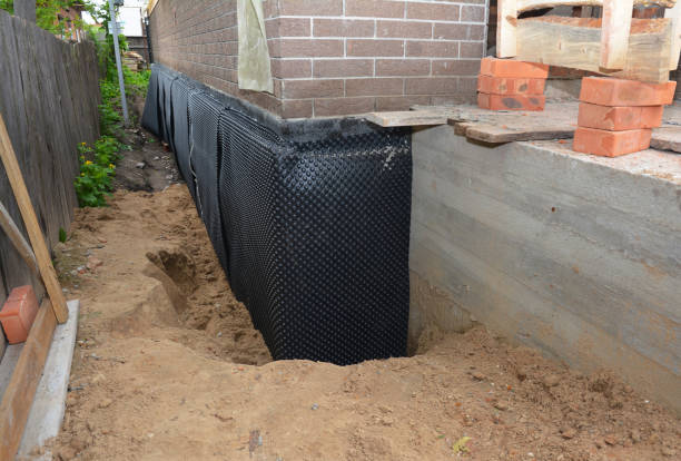 SJ Waterproofing Pros technician performing targeted Exterior Waterproofing assessment in Stony Brook, NY